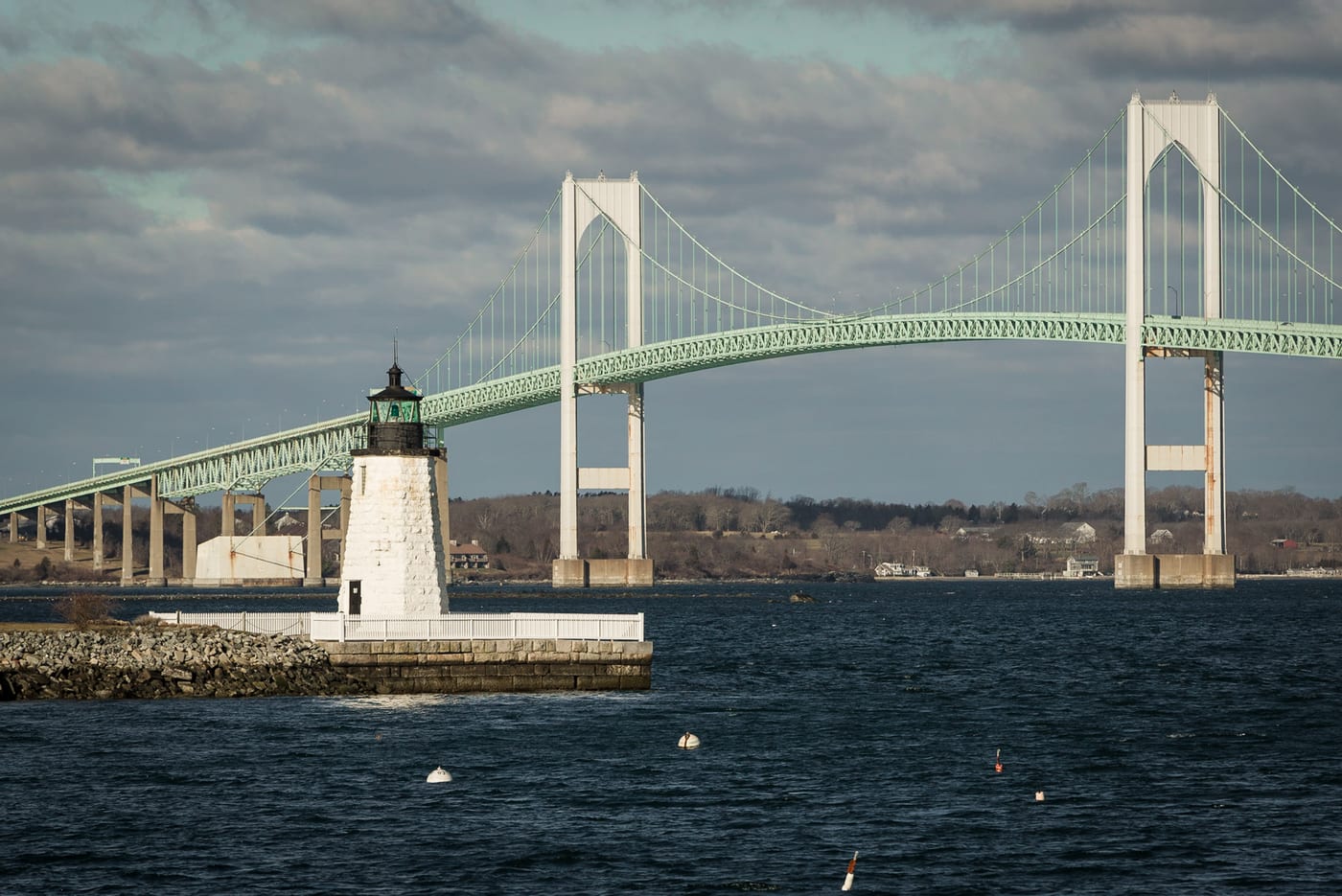 Goat Island Lighthouse with the Newport Bridge in Rhode Island