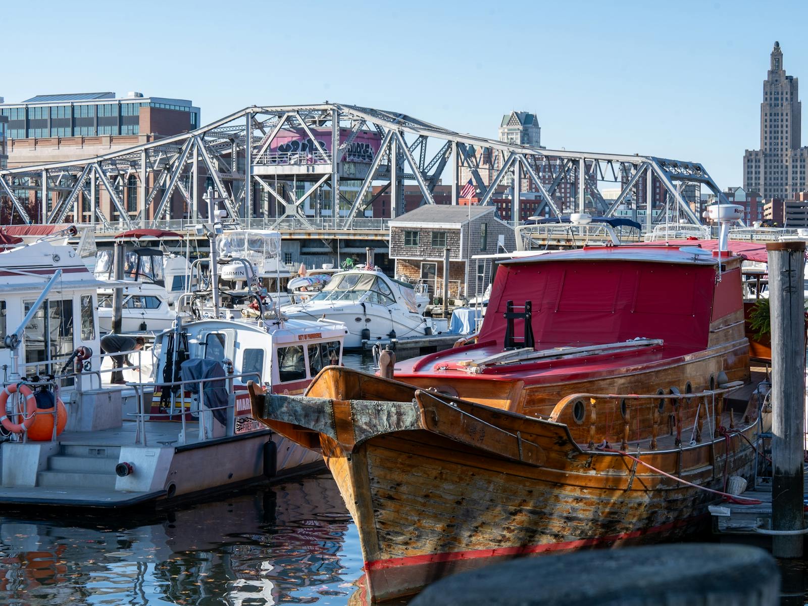 Providence waterfront marina with downtown buildings and a river bridge